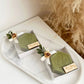 Savon d'olive personnalisé décoré avec ruban et fleur dorée pour cadeau d'invité